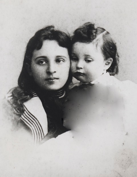 A person and a child posing for a photo  Description automatically generated